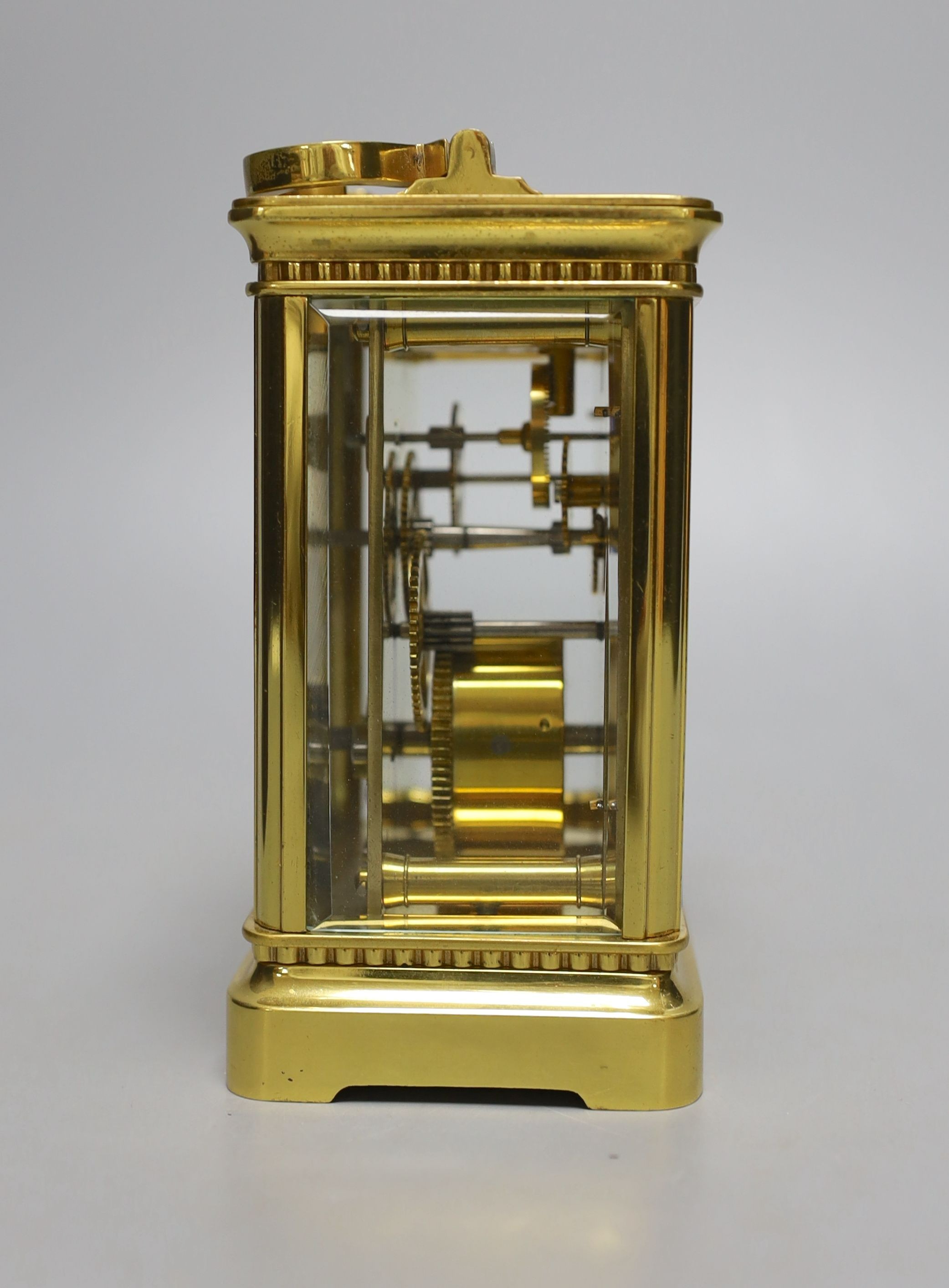 A cased French gilt brass carriage timepiece with relief cast dial and engraved presentation inscription - 14cm tall